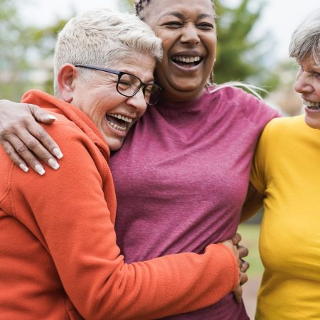Multiracial senior women having fun together after sport workout outdoor - Main focus on right female face